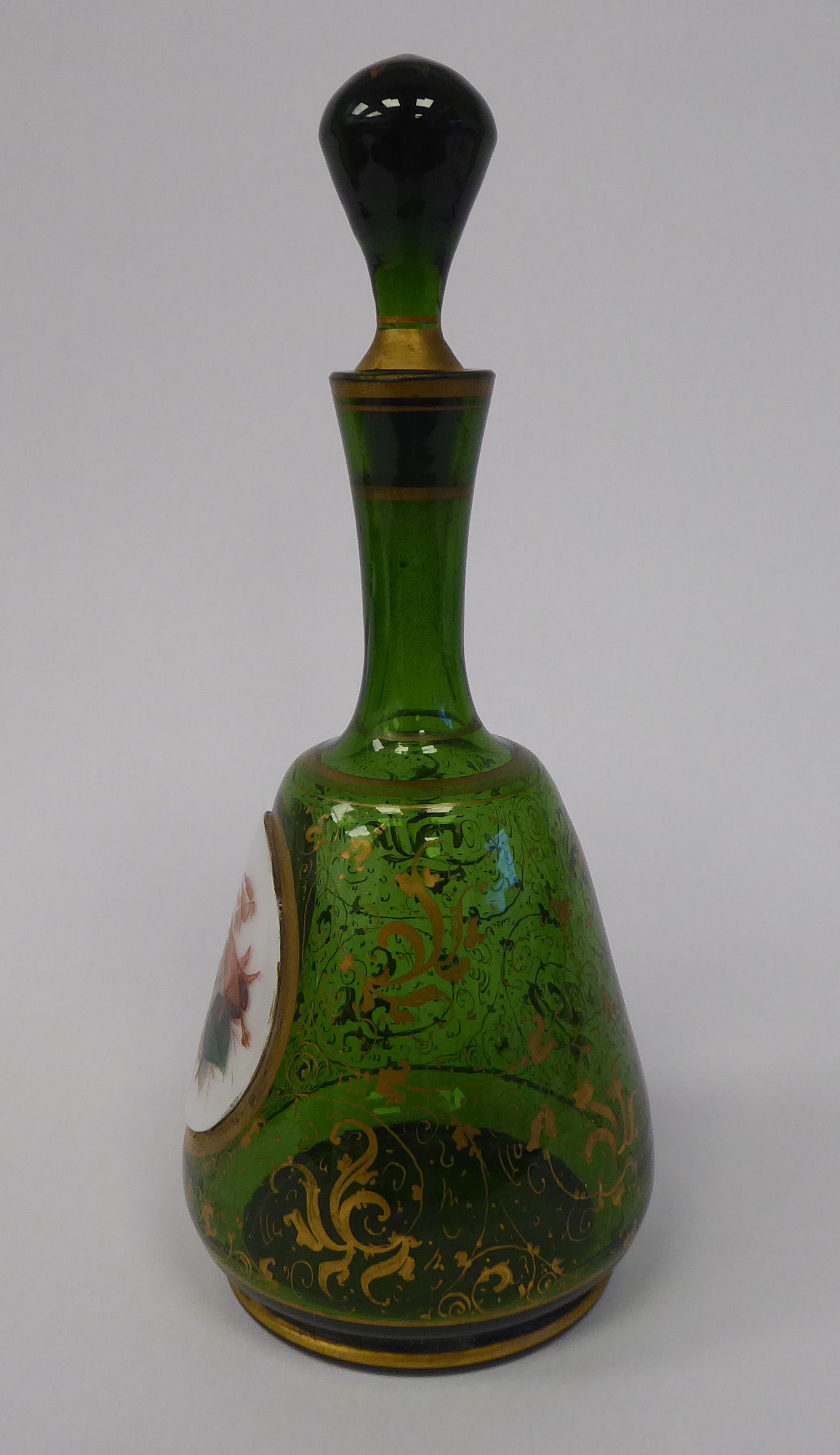 A late 19thC Bohemian decoratively gilded, green glass, mallet shaped dressing table decanter, - Image 2 of 7