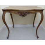 A late 19thC French walnut centre table, the top with a serpentine outlined edge,