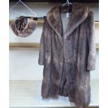 A light brown mink coat and matching hat