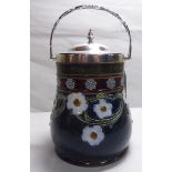 An early 20thC Royal Doulton Lambeth stoneware biscuit barrel with a silver plated collar,