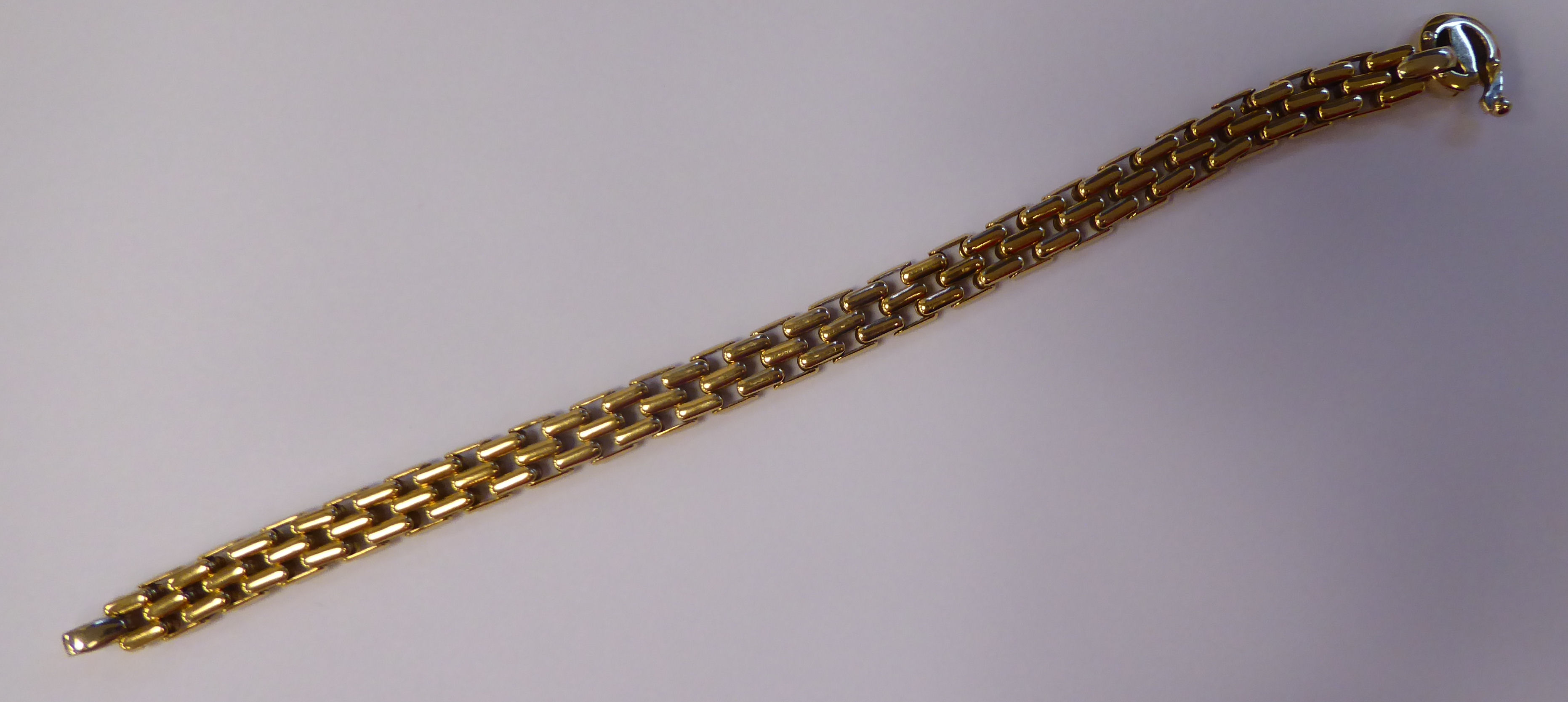 An 18ct gold wide, triple row, extended link bracelet,