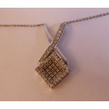 An 18ct white gold, diamond set pendant,