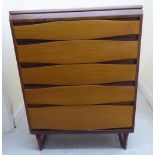 A 1970/80s teak five drawer dressing chest, raised on tapered supports 43''h 31.