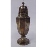 A silver caster of shouldered, octagonal pedestal vase design with a decoratively pierced,