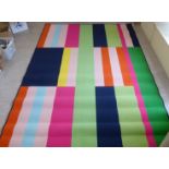 A modern machine made rug on a multi-colour ground 78'' x 90''