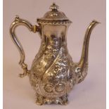 A 1920s North American Sterling silver Georgian style small coffee pot of bulbous form with a