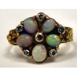A gold coloured metal opal and diamond set cluster ring