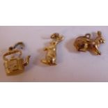 Three 9ct gold charms, viz.