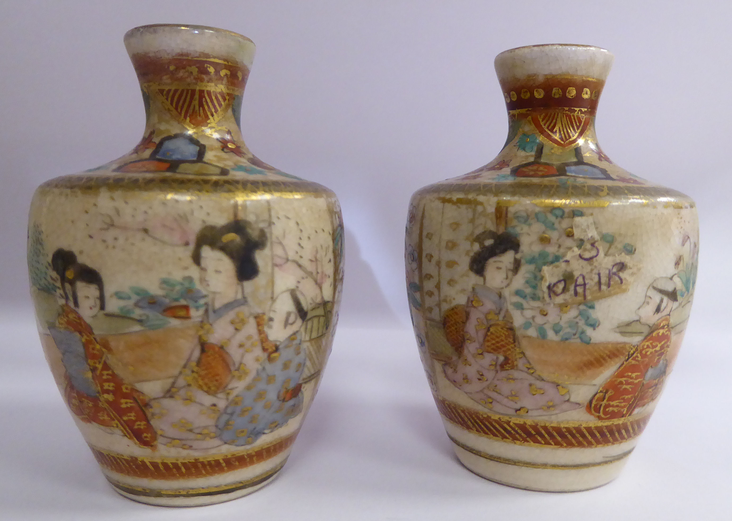 A pair of early 20thC Satsuma earthenware vases of shouldered baluster form,