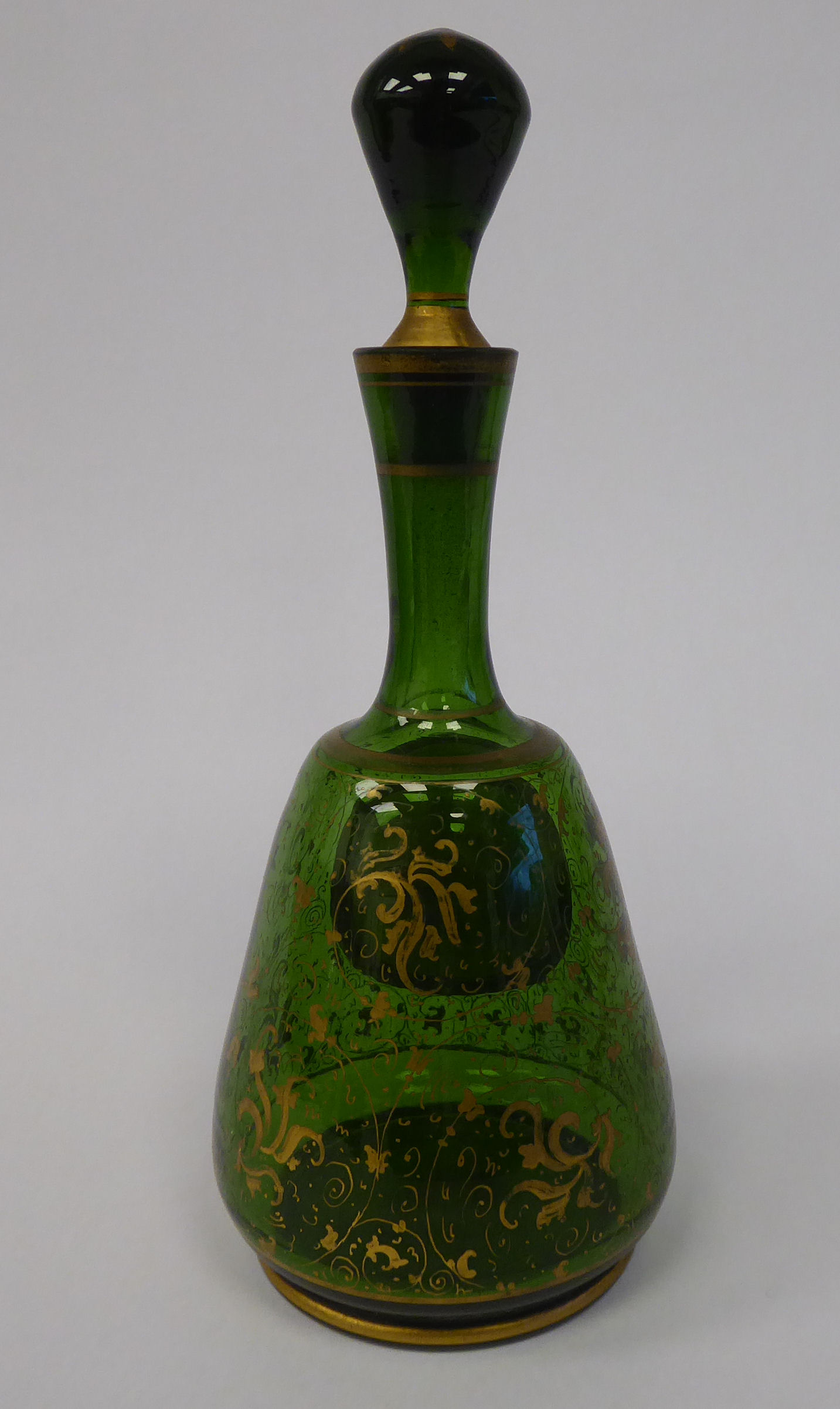 A late 19thC Bohemian decoratively gilded, green glass, mallet shaped dressing table decanter, - Image 3 of 7