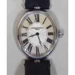A lady's Frederique Constant oval, stainless steel cased wristwatch, faced by a Roman dial,