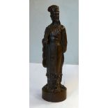 A late 19thC Japanese cast and patinated bronze standing figure,