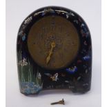 An early 20thC cloisonne cased mantel timepiece of round arch form,