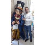 Chris Sims - a moulded and painted 7ft high papier mache figure, The Mad Hatter,