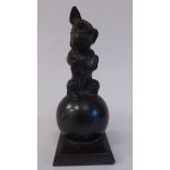 An early 20thC patinated spelter novelty table lighter, fashioned as a begging terrier,