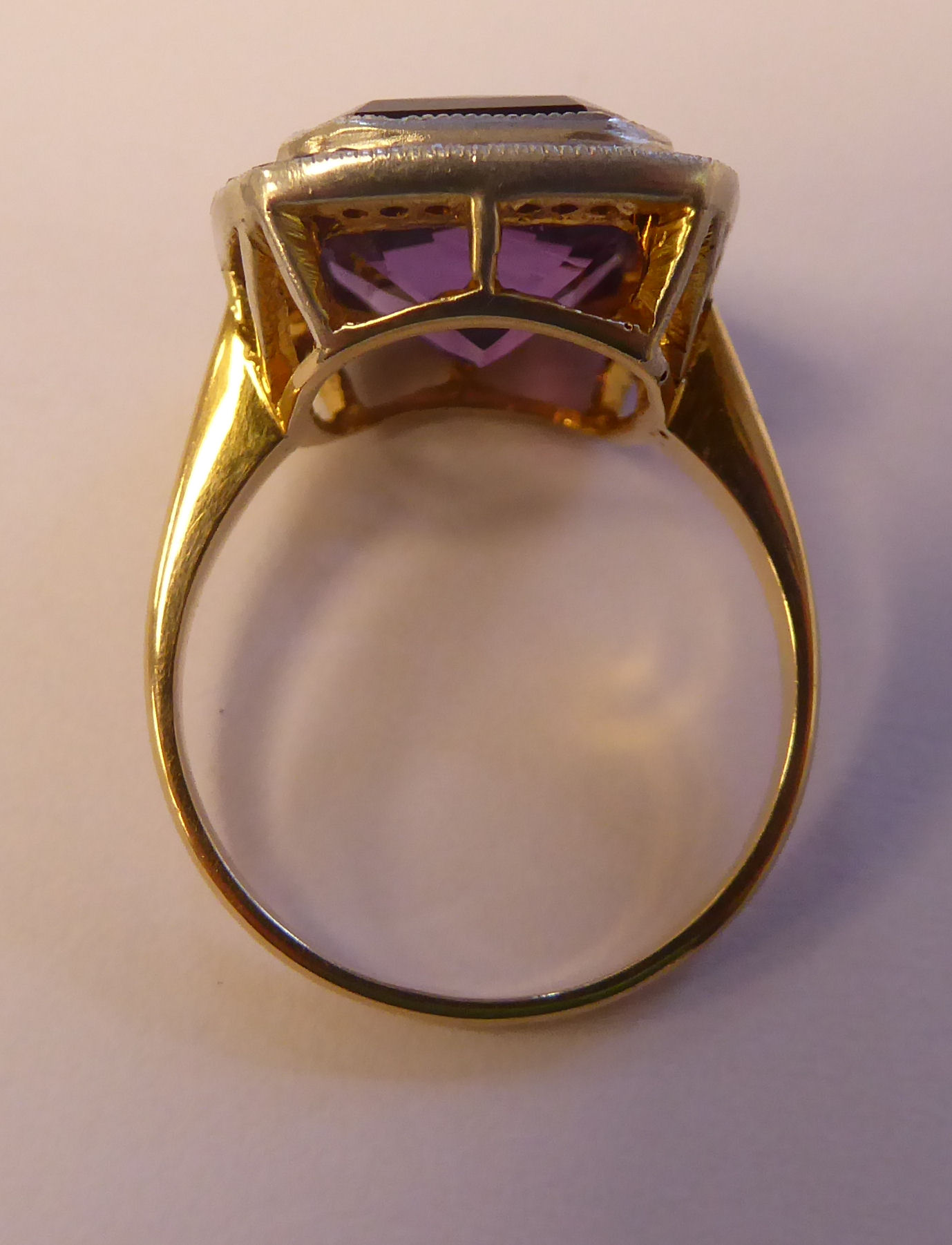 A gold coloured metal ring, set with an amethyst, - Image 4 of 4