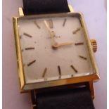A lady's 18ct gold cased Omega wristwatch of square form, faced by a baton dial, on a hide strap,