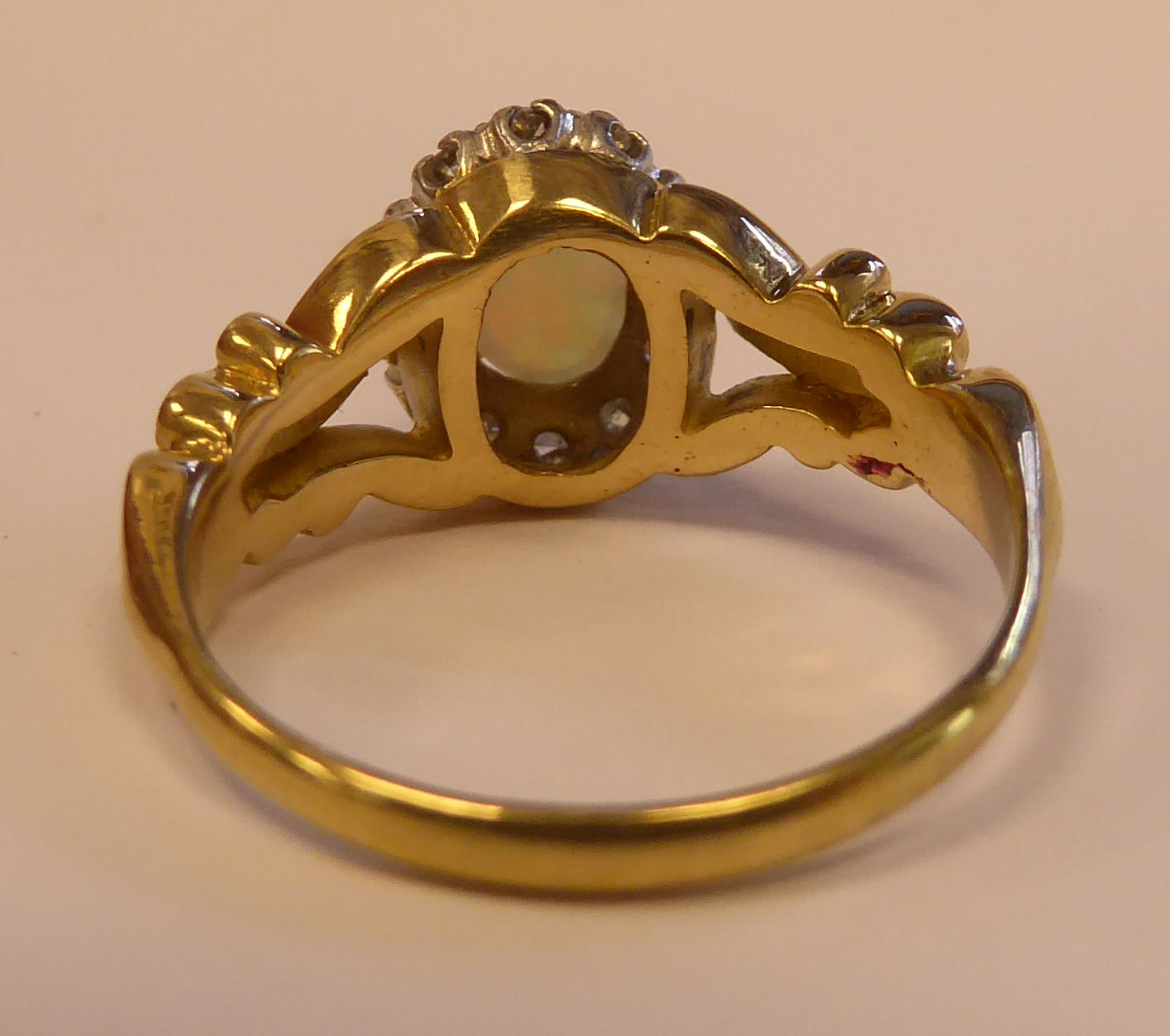 An 18ct gold ring, claw set with an opal, surrounded by diamonds, - Image 3 of 4