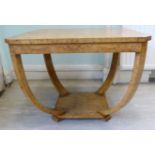 An Art Deco design satin burr walnut veneered lamp table, the square top with canted corners,