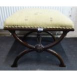 A modern mahogany stool with a cream fabric upholstered top,