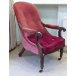 A Regency rosewood framed open arm salon chair, the red fabric upholstered back,
