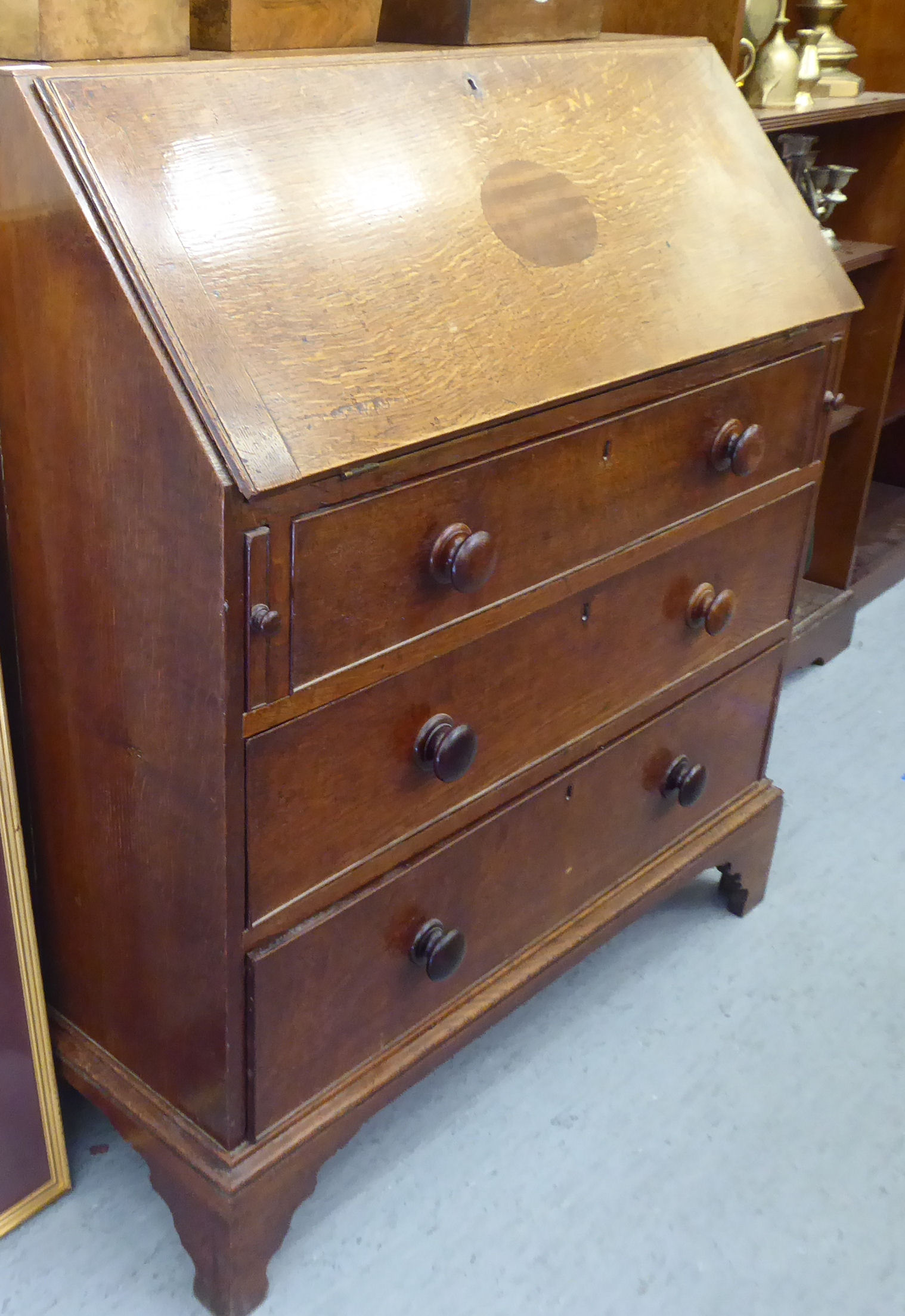 A George III oak bureau, the fall flap over three graduated drawers, - Image 2 of 4