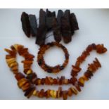 A rough cut amber coloured and other irregular cut amber coloured fragments OS10