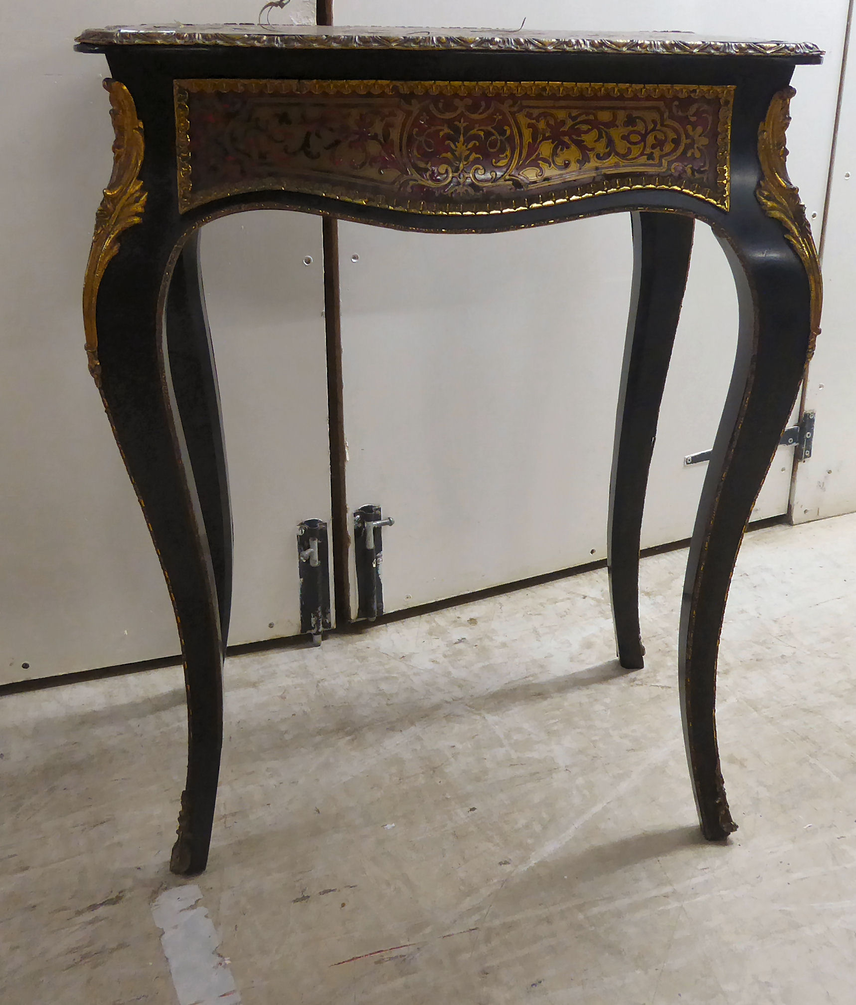 A late 19thC Louis XV design boulle side table, the serpentine outlined top with gilt metal border,