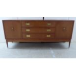 A vintage design mahogany finished sideboard with a bank of three central drawers with brass