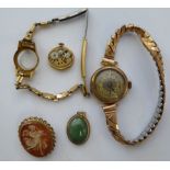 A 9ct gold framed cameo brooch; a 9ct gold cased pocket watch; a 9ct gold framed,