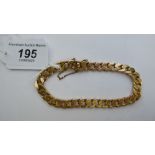 A 14ct gold flattened curb link bracelet,