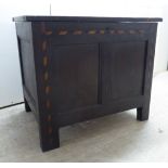 An early 19thC oak coffer with a loose lid, over straight sides,