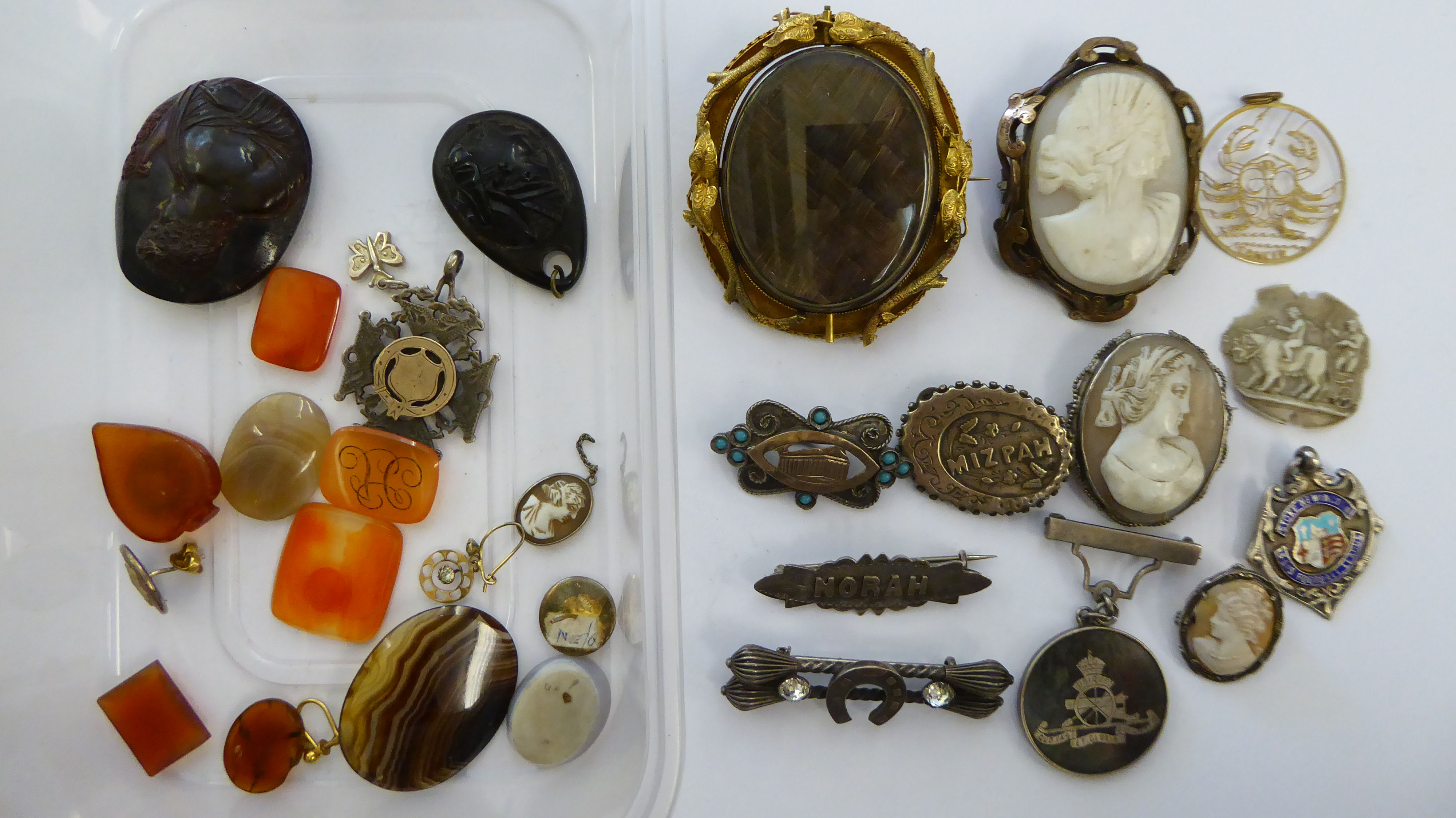 Items of personal ornament: to include three various cameo brooches;