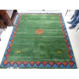 A modern woollen rug, decorated with stylised animals and zig-zag patterns,