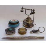 Collectable items: to include a miniature white metal telephone instrument; and a novelty keyring,