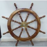 A modern stained beech and teak ships' wheel 36''dia BSR