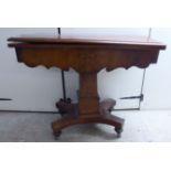 An early/mid 19thC mahogany tea table,