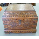 A 20thC Asian hardwood jewellery casket with profusely inlaid brass ornament,