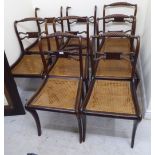 A set of eight Regency faux rosewood stained beech framed scroll back dining chairs,