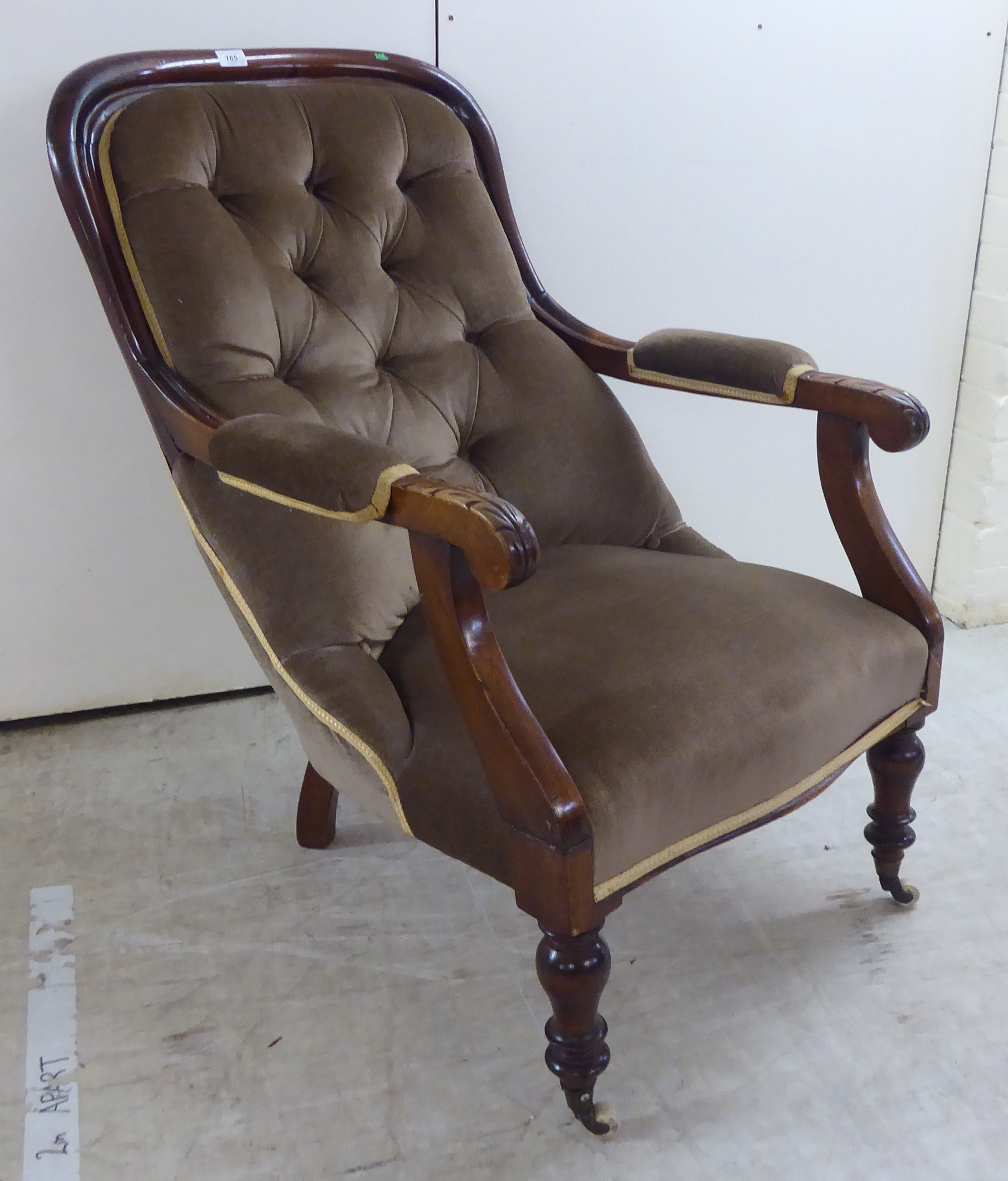 A mid Victorian mahogany showwood framed open arm chair,