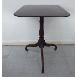 A George III mahogany pedestal table, raised on a turned baluster column,