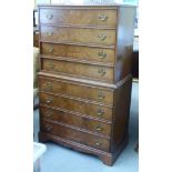 A mid 20thC burr walnut and mahogany finished, eight drawer chest-on-chest,