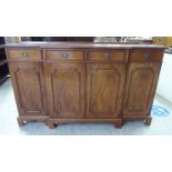 A modern crossbanded yewwood breakfront sideboard with four frieze drawers,