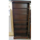 A modern mahogany open front six tier bookcase,