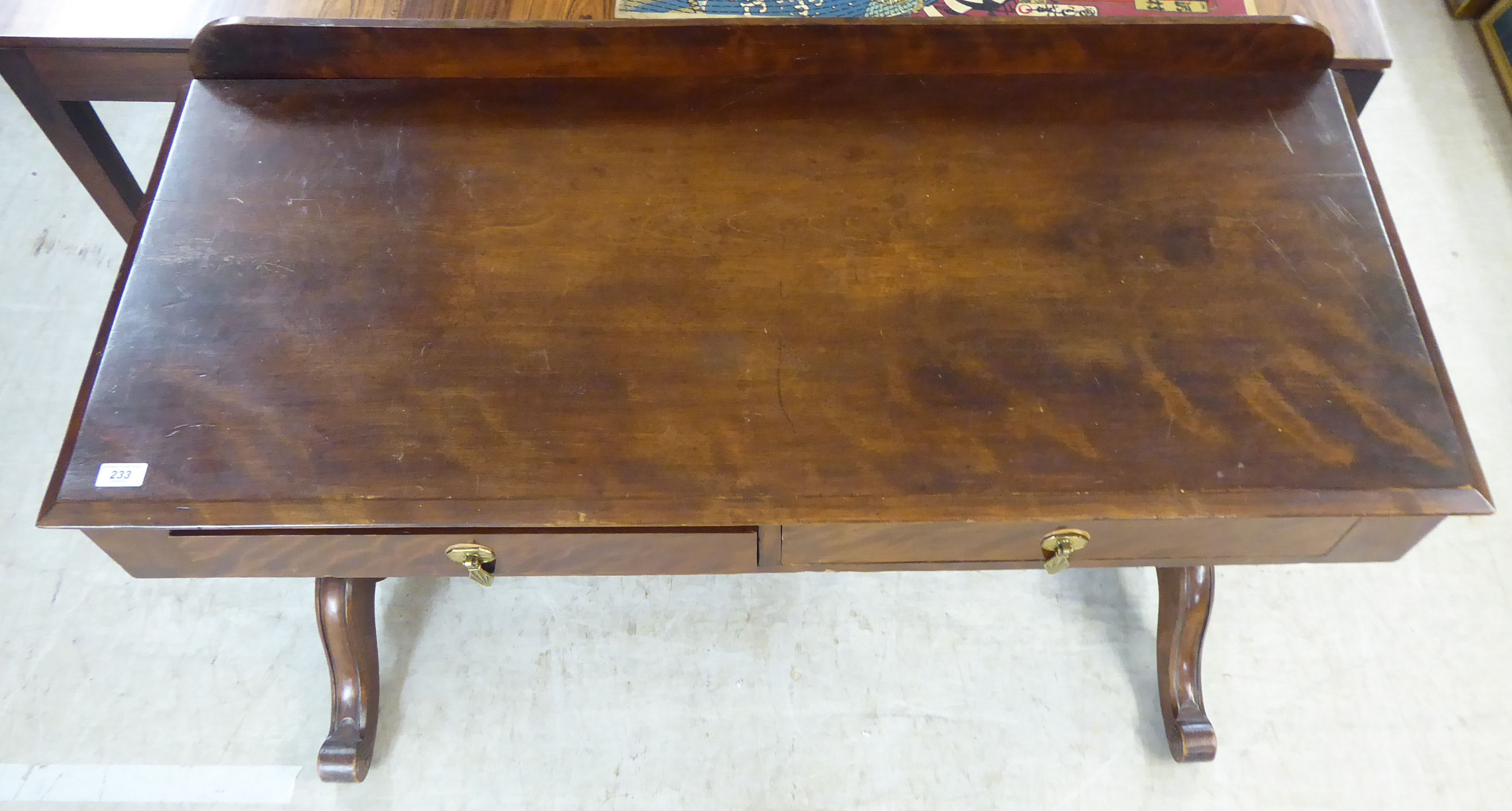 A late 19thC mahogany hall table, the top with a low upstand and chamfered edge, raised on carved, - Image 2 of 3