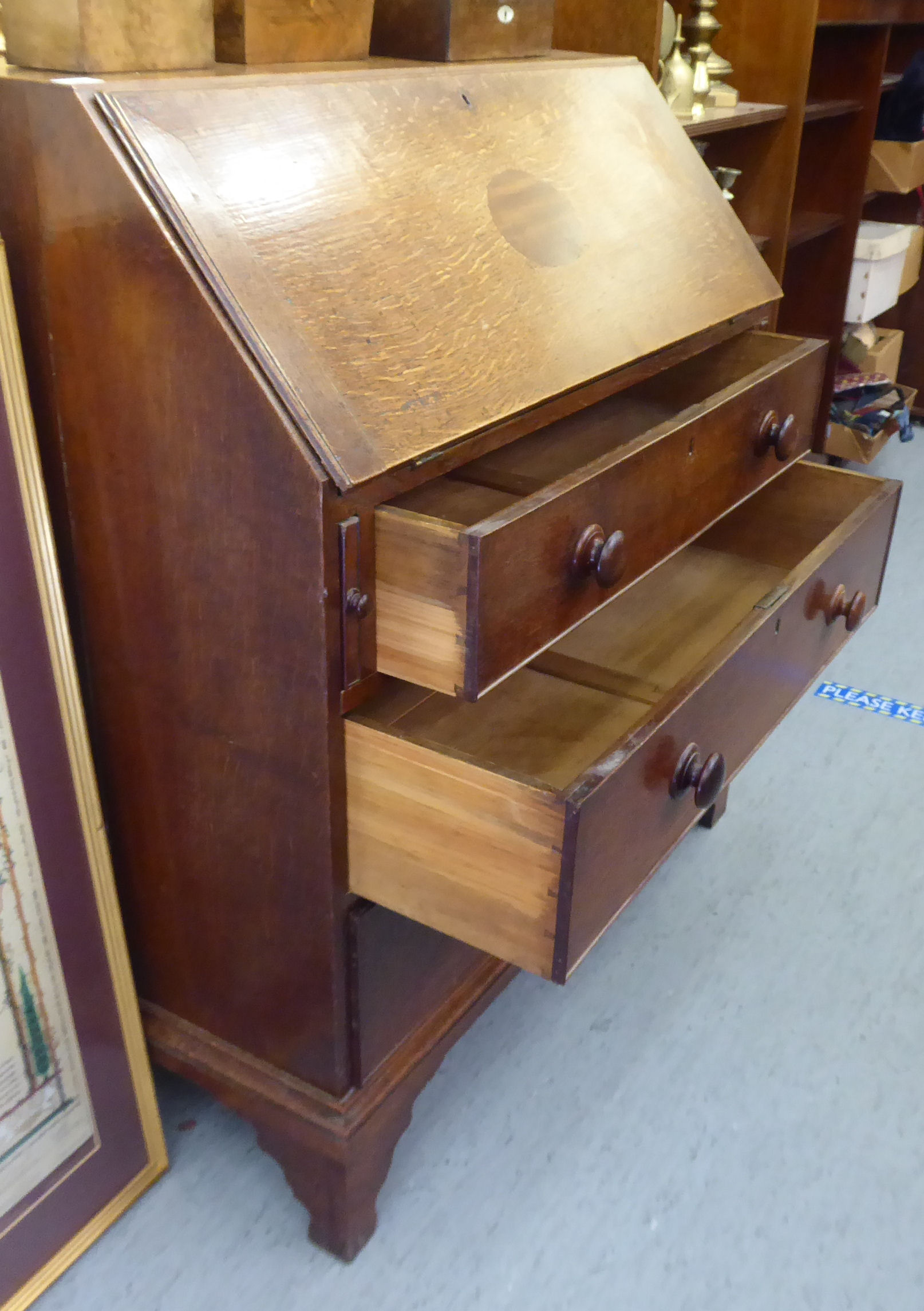 A George III oak bureau, the fall flap over three graduated drawers, - Image 4 of 4