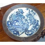 A late 19thC Chinese blue and white crackle glazed porcelain charger, decorated with birds,