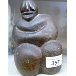 A Zimbabwean stone abstract figure 'Coming of Age' bears an impressed signature R MTEKI 6''h