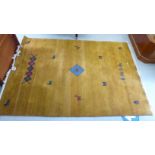 A modern woollen rug, decorated with stylised animals and zig-zag patterns,