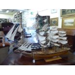A part painted model man-o-war with full rigging and sails 39''L overall;